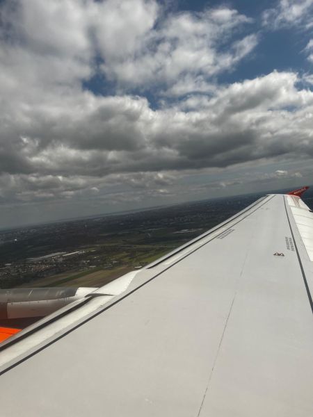 A shot over the plane wing on final approach into Schiphol. Although this is a little way out of the city centre, the characteristic landscape can still be seen represented in the upper left of the image.